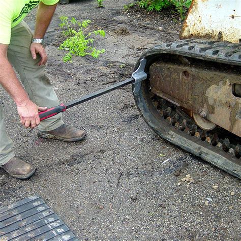 installing tracks on skid steer|skid loader track removal tool.